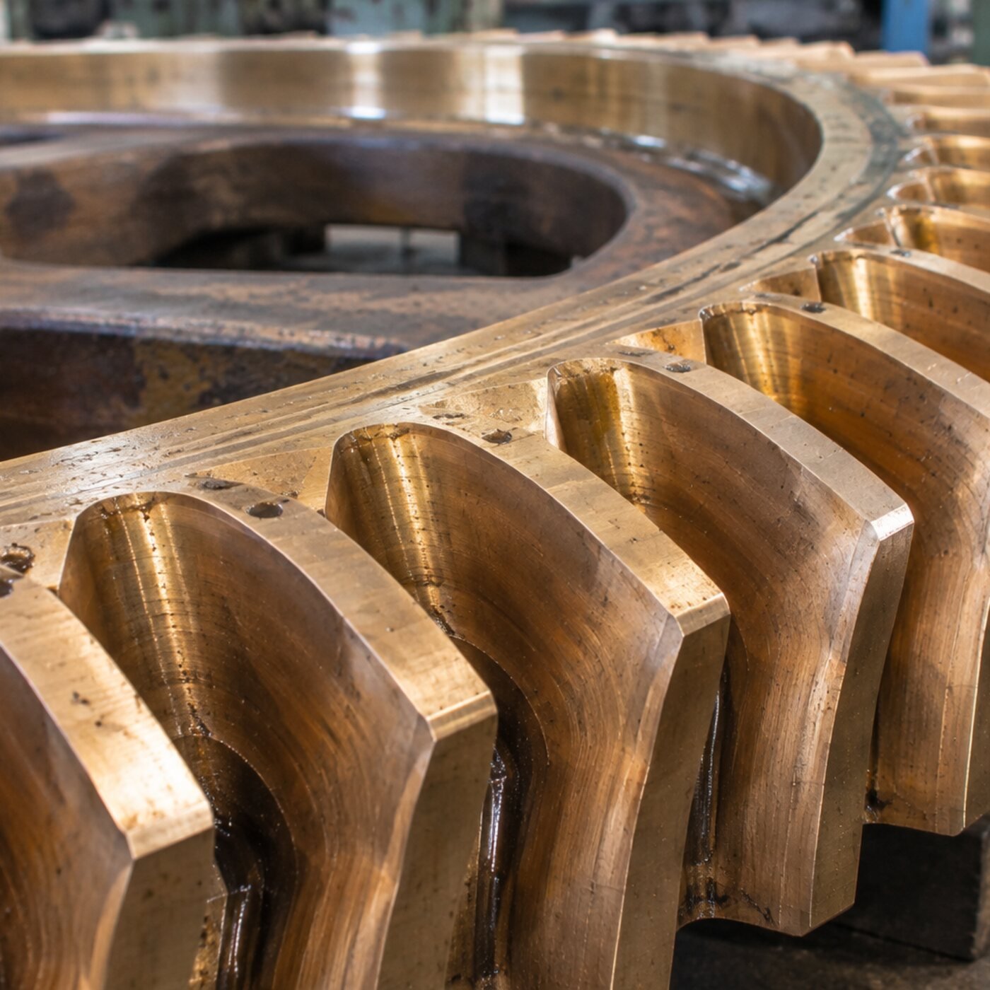 Close up of throated teeth on a bronze worm wheel made by Parkash Gears, worm gear manufacturer in Ludhiana